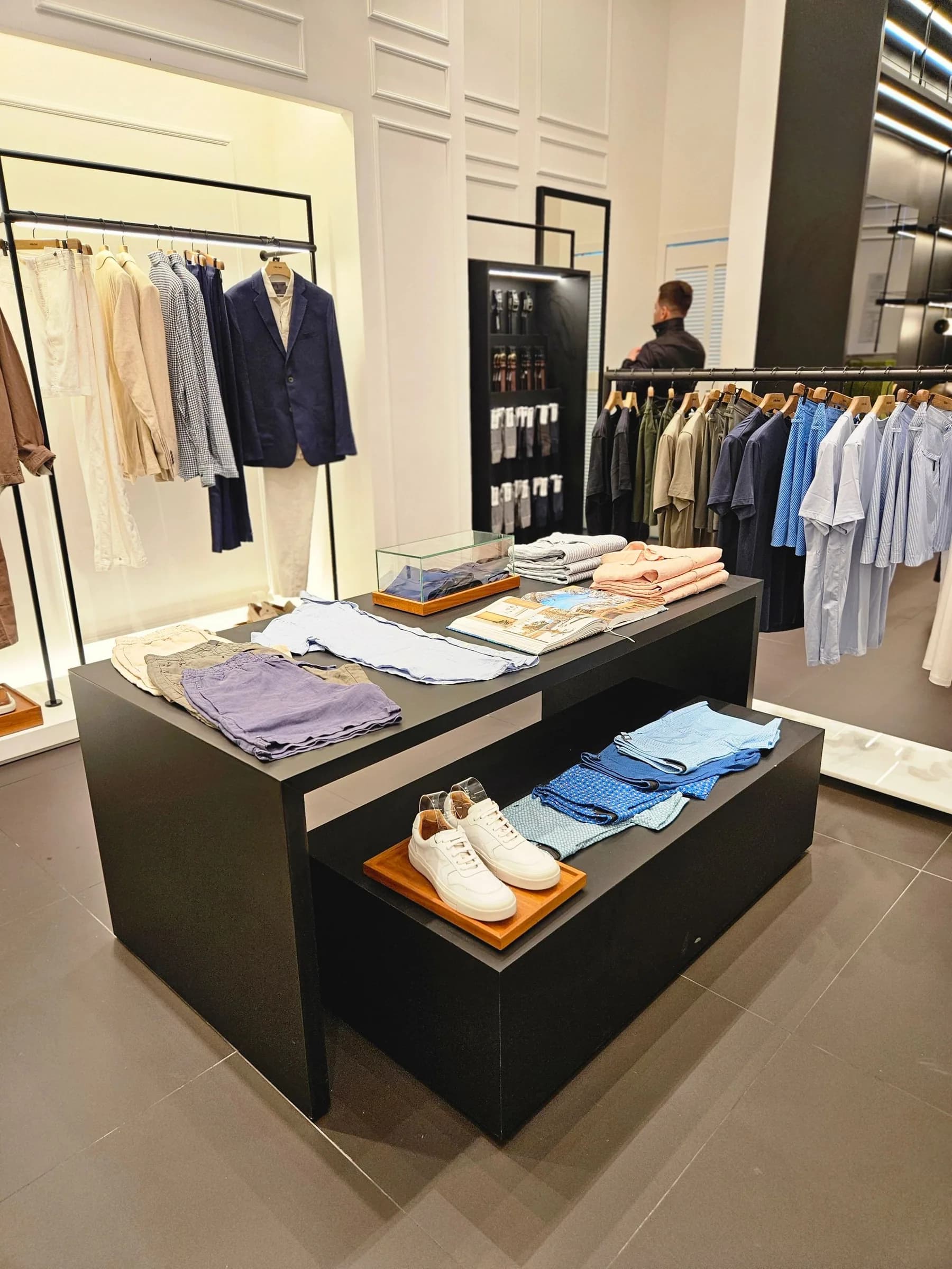 Finished, merchandised and open, reading as the brand from the pavement in.